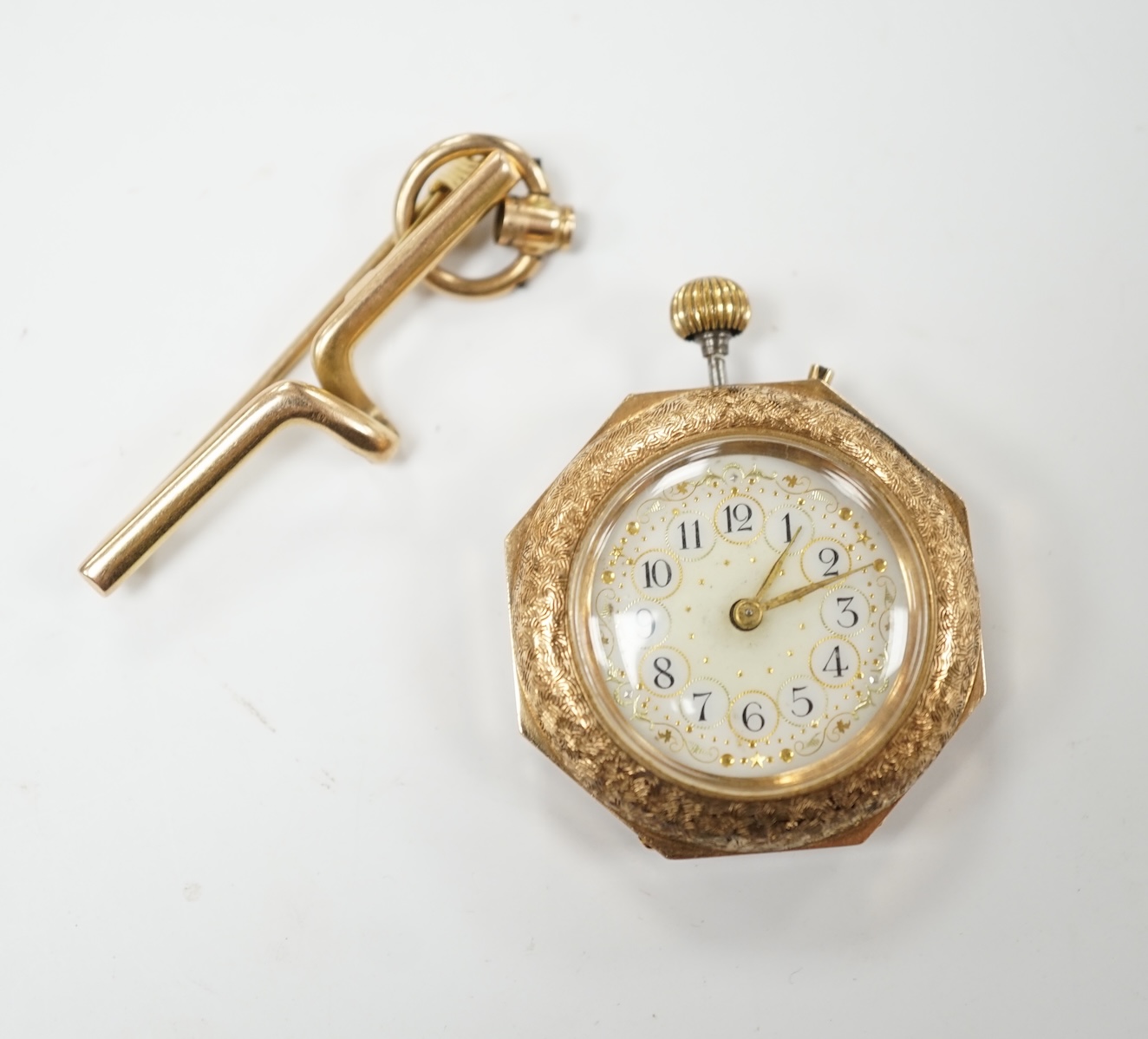 A lady's continental 14k fob watch, with Arabic dial, case diameter 29mm, gross weight 20.4 grams, together with a suspension brooch stamped '15', 3.3 grams. Condition - poor